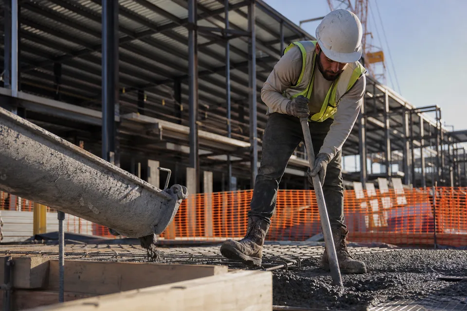 Commercial construction site with a tower crane, a general liability account